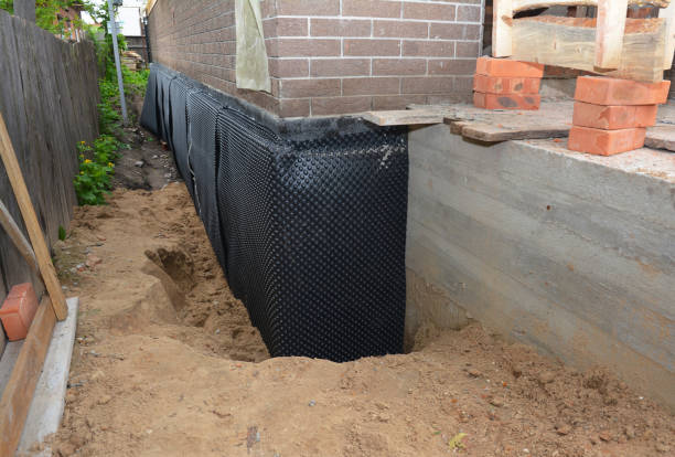 Happy homeowners after waterproofing job in Lapine